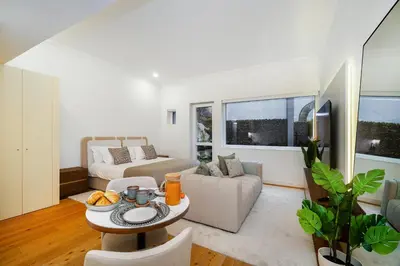 a living room with a couch and a table at WHome Modern Studio in Santa Catarina in Porto