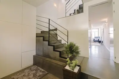 a hallway with a staircase in a house at Oporto Welcome Apartments - Ribeira Negra in Porto