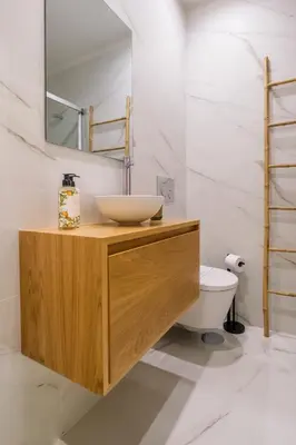 a bathroom with a sink and a toilet at Art Deco 32 Luxury 2BR Apartment Downtown Metro AC in Porto