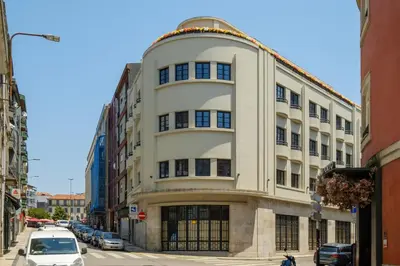 a large white building on a city street at Art Deco 13 Luxury 2BR Apartment Downtown Metro AC in Porto