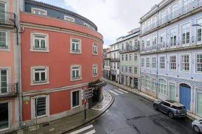 an empty street in a city with buildings at Art Deco 23 Luxury 2BR Apartment Downtown Metro AC in Porto