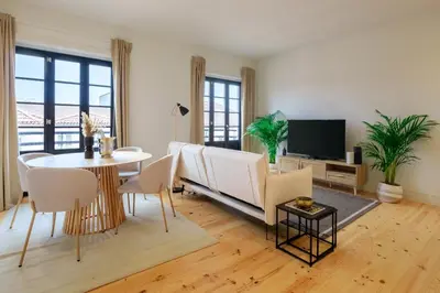 a living room with a couch and a table at Art Deco 33 Luxury 2BR Apartment Downtown Metro AC in Porto