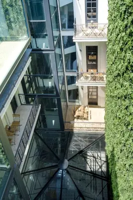 an elevator in a building with a glass ceiling at Art Deco 12 Luxury 2BR Apartment Downtown Metro AC in Porto