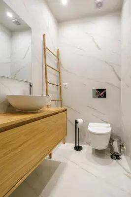 a bathroom with a sink and a toilet at Art Deco 22 Luxury 2BR Apartment Downtown Metro AC in Porto