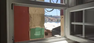 a window in a room with a view of a harbor at Stay in Apartments Ribeira 24 in Porto