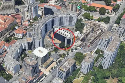 a building with a red circle on it in a city at Crystal Palace Oporto Flat - With Two Bedrooms in Porto