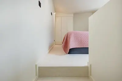 an overhead view of a living room with a couch and a table at Minimalist Loft @ Terracotta Collection in Porto