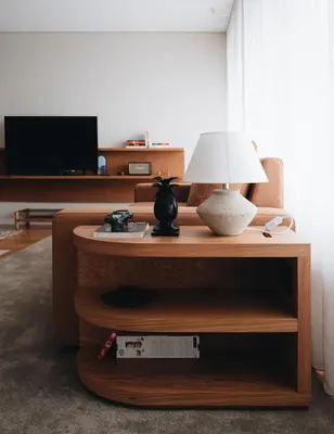 a living room with a table with a lamp on it at Flair Living in Vila Nova de Gaia