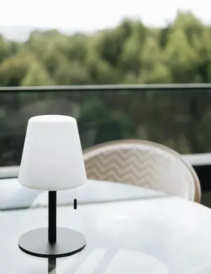 a white lamp sitting on top of a table at Flair Living in Vila Nova de Gaia