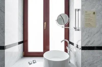 a bathroom with a white sink and a mirror at GuestReady - Elisium Star in Porto