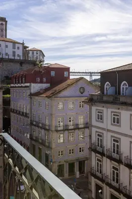 a view of a city with buildings and a bridge at OPO Ribeira I in Porto