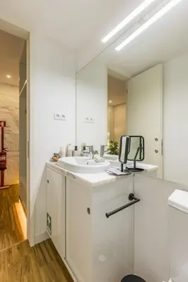a bathroom with a sink and a mirror at OPO Ribeira II in Porto