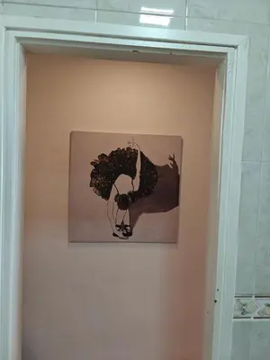 a painting of a woman with flowers on a wall at Ap Recanto do Pilar 5 min Ponte Luis in Vila Nova de Gaia