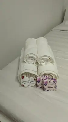 a group of towels sitting on a bed at Ap Recanto do Pilar 5 min Ponte Luis in Vila Nova de Gaia