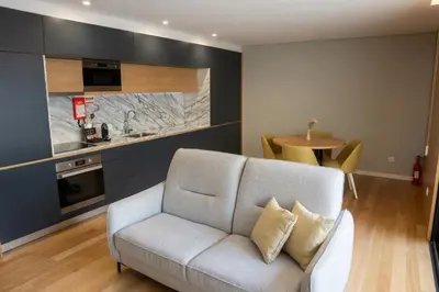 a living room with a flat screen tv on a stand at RS Porto Central Apartments in Porto
