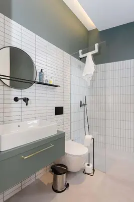 a bathroom with a sink and a toilet and a mirror at Liiiving in Porto - Crystal Luxury Apartment in Porto