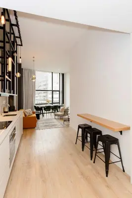 a kitchen and living room with a table and chairs at Liiiving in Porto - Crystal Luxury Apartment in Porto