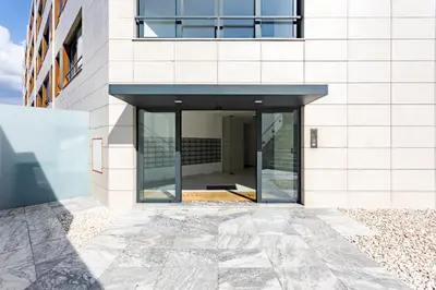 an external view of a building with a glass door at Studio w/ Terrace, Pool & Gym | Antas by Host Wise in Porto