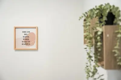 a picture frame on a wall next to a plant at GuestReady - Homely retreat in the city centre in Porto