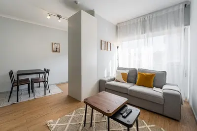 a living room with a couch and a table at GuestReady - Homely retreat in the city centre in Porto