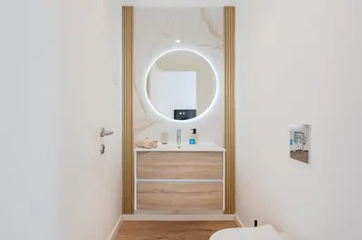 a white bedroom with a large bed and a window at The Prime Loft @ BoaVista Flats in Porto