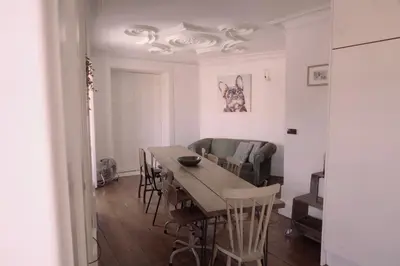 a living room with a table and a couch at Light & Airy Historic Centre House with Balconies in Porto