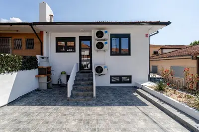a white house with a staircase leading to the front door at HostWise - Quinta do Vintém w/ Terrace near WOW in Vila Nova de Gaia
