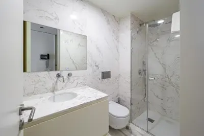 a bathroom with a toilet and a sink and a shower at 5daMaria - Porto Center in Porto