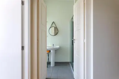 a bathroom with a sink and a mirror at Viela Chic by Cozy Stay in Porto