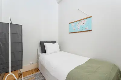 a small bedroom with a bed and a mirror at Viela Chic by Cozy Stay in Porto