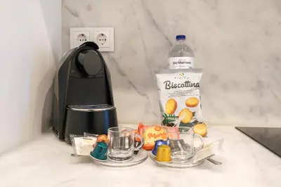 a bottle of water sitting on top of a counter at Art Deco 11 Luxury 2BR Apartment Downtown Metro AC in Porto