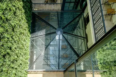 a glass window on the side of a building at Art Deco 21 Luxury 2BR Apartment Downtown Metro AC in Porto