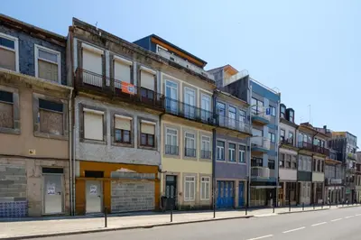 a row of buildings on a city street at Bonfim Garden Apartment Near Metro & City Center in Porto