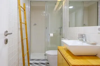 a bathroom with a sink and a shower and a toilet at Bonfim Garden Apartment Near Metro & City Center in Porto