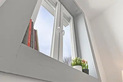 a window with a view of a building at Casa do Palácio 16 e 17 in Porto