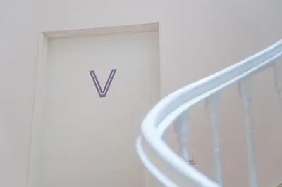 a white door with a letter on it at GuestReady - RNB Apartments in Porto