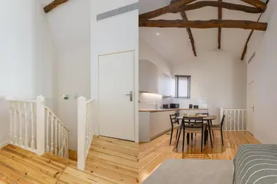 a bedroom and a kitchen with a table and chairs at Albertina Carlos Alberto by Aspasios in Porto