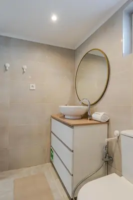 a bathroom with a sink and a mirror at Quinta do Vintém near WOW by HostWise in Vila Nova de Gaia