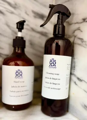 two bottles of soap sitting next to each other at The Arcada House by MyMoradia in Porto