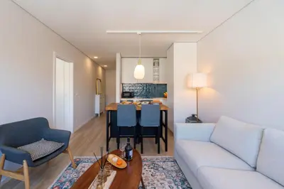 a living room with a couch and a table at HostWise - Modern Flat in Boavista in Porto