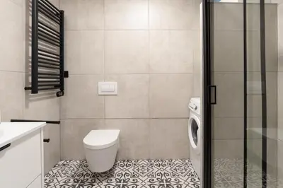 a bathroom with a toilet and a shower at HostWise - Modern Flat in Boavista in Porto