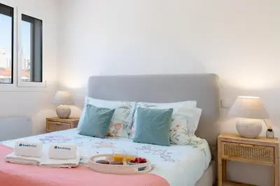 a bedroom with a bed with a basket of fruit on it at HostWise - Modern Flat in Boavista in Porto