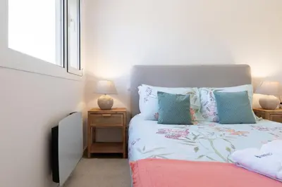 a bedroom with a bed and a window at HostWise - Modern Flat in Boavista in Porto