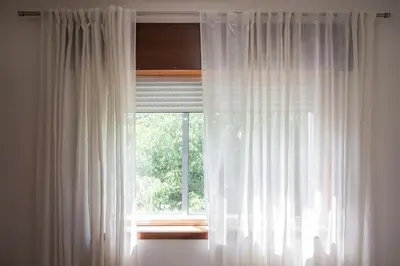 a window with white curtains in a room at Aposentus - Cest La Vie in Porto