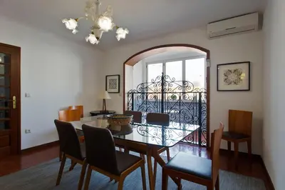 a dining room with a table and chairs at APOSENTUS - The Palazzo in Porto