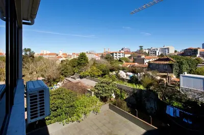 a view of a city from a balcony at APOSENTUS - The First in Porto