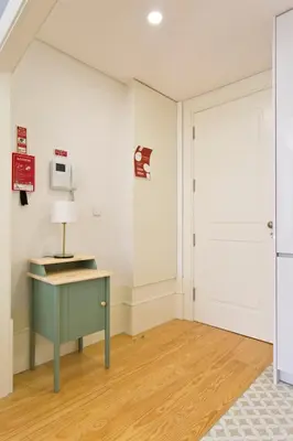 an empty room with a desk and a door at Aposentus - Formosa Boutique in Porto