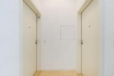 a hallway with two doors and a tile floor at GuestReady - A lovely stay in Rua da Boavista in Porto