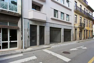 an empty street with buildings on the side of the road at APOSENTUS - Porto's Charming Apartment in Porto