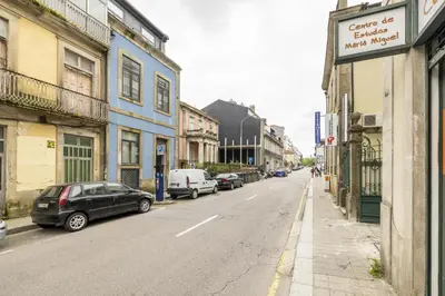 a street with cars parked on the side of the road at 741 Studio By D&S in Porto